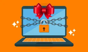 Un portátil con cadenas y un candado, adornado con un lazo rojo, simboliza la seguridad de Windows.