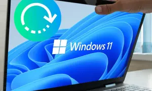 Icono de ciclo de reinicio sobre pantalla de laptop con logo de Windows 11. Ideal para guías sobre cómo restaurar Windows 11.