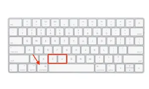 Teclado de Mac con las teclas Comando, X, C y V resaltadas, indicando la combinación para copiar.