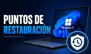 Guía para restaurar Windows 11 a un punto anterior. Laptop con logo de Windows 11 y un icono de escudo con flecha circular.