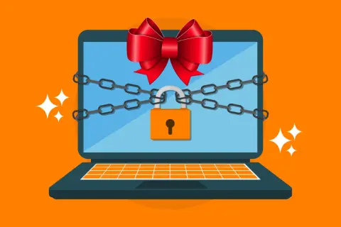 Un portátil con cadenas y un candado, adornado con un lazo rojo, simboliza la seguridad de Windows.