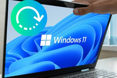 Icono de ciclo de reinicio sobre pantalla de laptop con logo de Windows 11. Ideal para guías sobre cómo restaurar Windows 11.