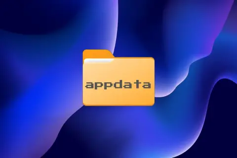 Carpeta naranja con el texto "appdata" en píxeles, sobre un fondo azul abstracto. Ideal para ilustrar la tarea de limpiar appdata.