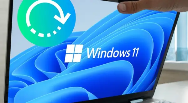 Icono de ciclo de reinicio sobre pantalla de laptop con logo de Windows 11. Ideal para guías sobre cómo restaurar Windows 11.