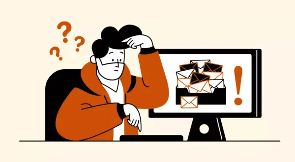Hombre confundido frente a un monitor con muchos correos. Aprende cómo eliminar correos no deseados en Gmail y recupera tu tranquilidad.