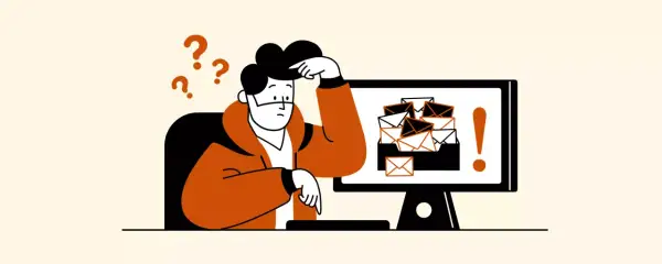 Hombre confundido frente a un monitor con muchos correos. Aprende cómo eliminar correos no deseados en Gmail y recupera tu tranquilidad.